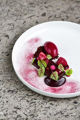 Fine dining dessert, Raspberry Parfait, ice cream, white chocolate mousse and spices