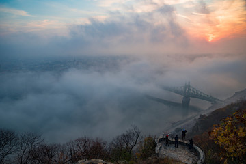 Obraz premium floating fog in Budapest sunrise at Citadella Gellert hill