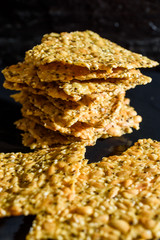 Stack of fresh and tasty homemade seed crackers.