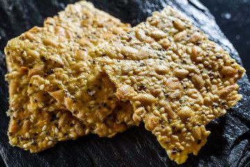 Stack of fresh and tasty homemade seed crackers.