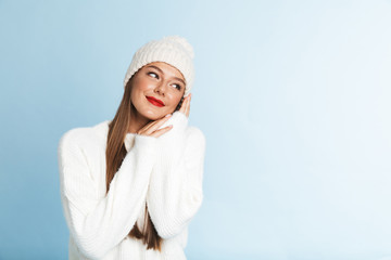 Pretty young woman wearing sweater and hat