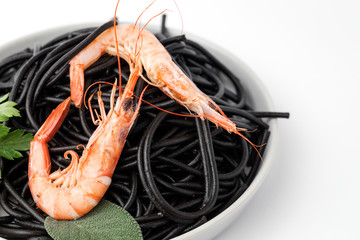 Black spaghetti with prawns. Homemade.
