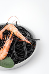 Black spaghetti with prawns. Homemade.