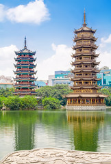 The Sun and Moon Twin Pagodas at Shanhu Lake (Fir Lake) in downtown of Guilin in China.
