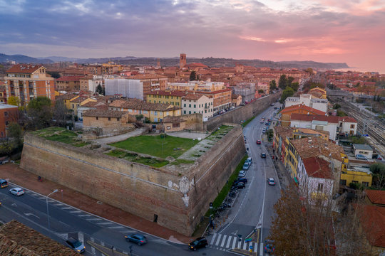 Aerial panorama of popular travel destination beach town Fano in Italy with sunset blue, red, purple sky near Rimini in the Marche region.