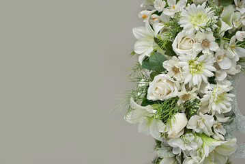 Bouquets of white roses, chamomile and other flowers on a white background.