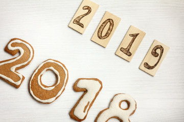 2018 cookie-shaped digits are being replaced with wooden signs 2019 happy new year