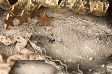 golden stars in the snow, in the background of a dark night