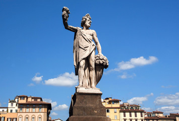 Obraz premium Dionysus sculpture standing on street of Florence. The god of the grape-harvest, winemaking and wine under the streets of historical Firenze, Italy