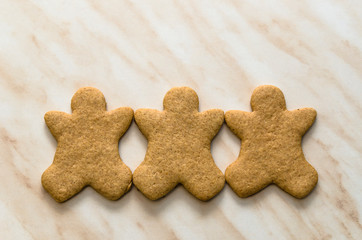 Home-baked gingerbread on a kitchen surface with baking paper - Christmas concept with home-baked cookies in the kitchen