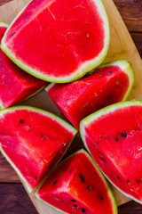 Fresh sliced watermelon wooden background