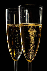 Champagne glasses for festive occasion against a dark background