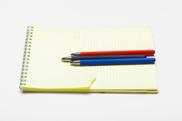 notepad notebook and ball pont pen isolated on white background