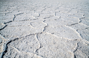 Fototapeta na wymiar Close view of the Bad Water salt field in the lowest point of North America. An impressive atmosphere in the huge valley copmpletely covered by salt.
