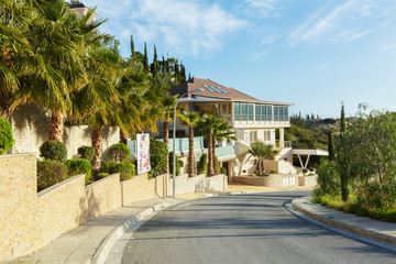 Empty street at the nice and comfortable great garden under lovely blue sky