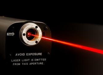 Laser beam from lab laser. Warning notice on front. Aperture is not noisy, it looks this way due to...