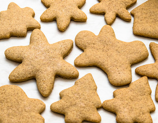 Home-baked gingerbread on a kitchen surface with baking paper - Christmas concept with home-baked cookies in the kitchen