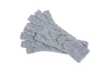 Knitted gray gloves with open fingers isolated on white background. Handwork. View from above.