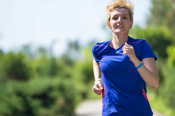 young female runner training for marathon
