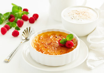 Creme brulee. dessert with caramel crust and berries.