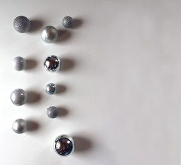 Silver christmas balls on white background