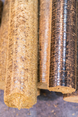 Pellets close up. Wood pellets close up .Biofuels. Biomass Pellets - cheap energy. The cat litter. vertical photo