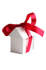 Paper house and ribbon on white background