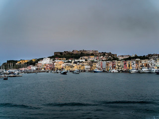 Fototapeta na wymiar Italy, Campania, Gulf of Naples, Naples, Procida Island with colorful houses in the morning and Marina di Sancio Cattolico