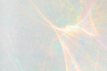 Multicolored glow on silver paper