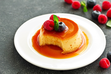 delicious dessert creme brulee with berries.