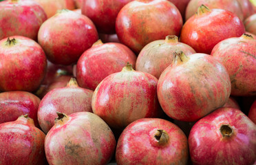Fototapeta na wymiar Ripe Pomegranates. Bright fruit background (Selective focus)