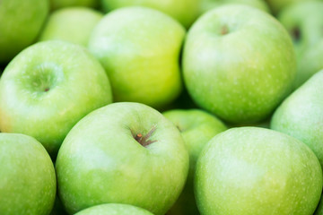  Heap green apples. Fall harvest, farming agricultural concept (selective focus)