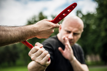 Knife vs knife. Kapap instructor demonstrates fighting and disarming technique