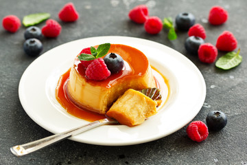 delicious dessert creme brulee with berries.