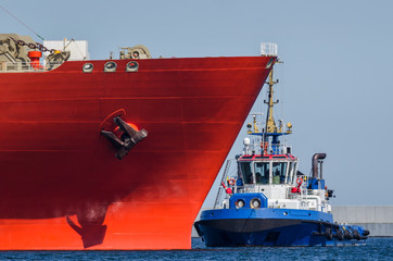 TUGBOAT AND SHIP - Ships maneuver in the port