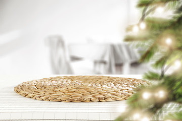 Fototapeta premium White table background and christmas tree 