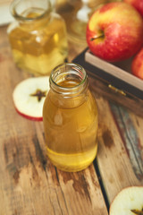 Fototapeta na wymiar Apple cider vinegar. Bottle of apple organic vinegar