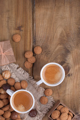 St. Nicolas day concept. Dutch holiday Sinterklaas, festive breakfast with coffee, kruidnoten, traditional sweets and presents. Top view. Free space for text.