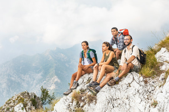 Italy, Massa, group of people hiking and looking at the view in the Alpi Apuane