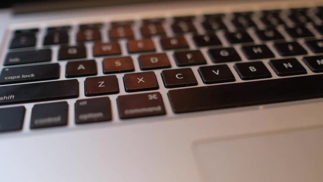 Close-up of laptop keyboard with focus buttons key. Royalty high-quality stock video footage of laptop keyboard buttons. blurry background and focus computer keyboard