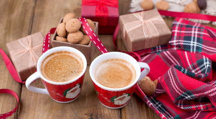 St. Nicolas day concept. Dutch holiday Sinterklaas, festive breakfast with coffee, kruidnoten, traditional sweets and presents. Top view. Free space for text.