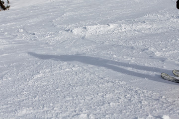 Fototapeta na wymiar Shadow of a skier in the snow in winter