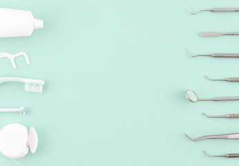 Dentist tools. Teethcare, dental health concept. Light blue background top view copy space flat lay. Teeth care fresh breath