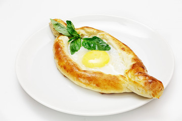 Georgian tortilla with egg on a white background