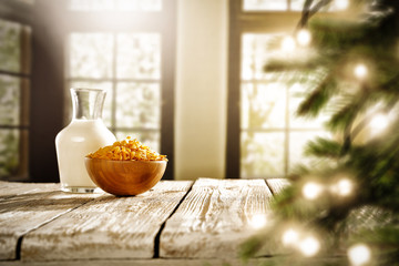 Christmas breakfast time with blurred background of window and christmas tree. 