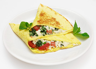 Quesadia with meat, cheese and vegetables on a white background