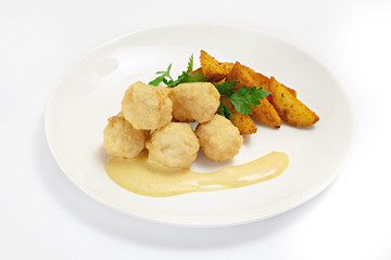 Roasted meat and vegetables on a white background