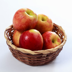 Jonagold apples in a basket on white background