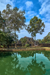 Fototapeta premium View of Baphuon temple at Angkor Wat complex is popular tourist attraction, Angkor Wat Archaeological Park in Siem Reap, Cambodia UNESCO World Heritage Site