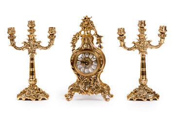 Vintage gold watch with candelabra on white background